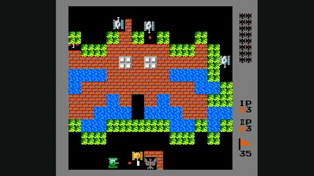 Tanks fire through brick walls and grass around a defended base in Battle City’s web port.