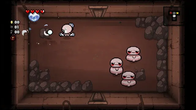 Isaac fires tears at enemies in a stone-filled basement room in chiikabu’s browser demonstration