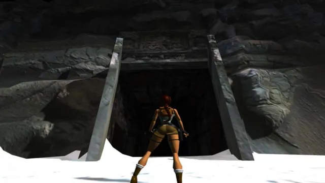 Lara Croft stands at a snowy cavern entrance in the 1996 Tomb Raider. Original-game reference.